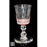 A 20th Century Scottish crystal drinking glass with a bucket form bowl having a radial millefiori