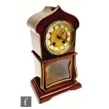 An Edwardian mahogany mantle clock in Persian style inlaid case, circular Arabic dial on bracket