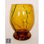 In the manner of Stuart & Sons a 1930s Art Deco goblet shaped vase, the crackled amber ground with