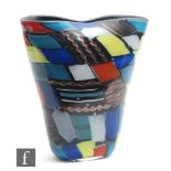 A mid 20th Century Italian Murano glass vase of compressed sleeve form, decorated with pezzatto