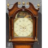 An early 19th Century oak longcase clock with an eight day movement striking on a bell, the case