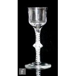 An 18th Century drinking glass circa 1770, the ogee bowl above a double series opaque twist stem