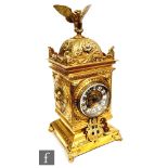 An early 20th Century French brass mantle clock with eight day striking movement, the case mounted