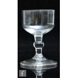 A late 18th Century dram glass circa 1780, the ovoid bowl above a stem with medial ball knop and