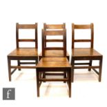 A set of four 19th Century cross-banded oak plank seat country dining chairs, S/D (4)