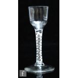 An 18th Century drinking glass circa 1760, the ogee bowl above a double series opaque twist stem