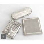 Three items of hallmarked silver to include two cigarette cases and a plain spectacle case dated