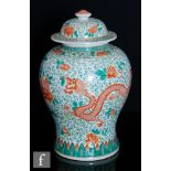 A Chinese famille verte 'Dragon' vase of baluster form, surmounted by a domed cover, the body