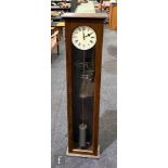 A 20th Century oak cased precision wall clock, circular dial with exposed workings and barrel