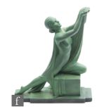 A 1930s Art Deco ceramic figure, in the manner of Leonardo, modelled as a semi-clad kneeling lady,