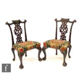 A pair of late 19th to early 20th Century mahogany standard or side chairs in the Chippendale style,