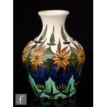 An early 20th Century Scottish Arts and Crafts vase decorated with hand painted stylised flowers and