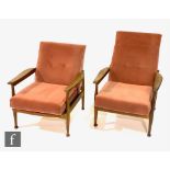 A pair of post war teak framed 'Manhattan' 'His and Hers' reclining armchairs, designed by George