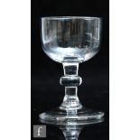 An 18th Century dram glass circa 1750, the ovoid bowl above a medial knopped stem and raised to a