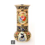 A 1920s Wiltshaw and Robinson Carlton Ware vase of globe and shaft form decorated in the '