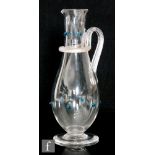 A late 19th Century Richardsons clear crystal glass jug of slender footed form with an applied