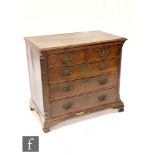 A George III mahogany bachelor's chest of two short and three long drawers below a brushing slide