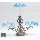A late 19th Century table centre epergne, the rococo scrolls silver plated stand mounted with a