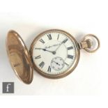 An American 10k full hunter crown wind pocket watch, engine turned case opening to a white enamelled