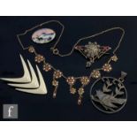Five items of continental silver jewellery to include two enamelled brooches, an enamelled necklet