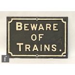 A cast iron Midland Railway 'Beware of Trains' sign, white lettering on black background, 38cm x