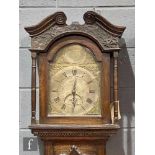 A late 18th Century oak longcase clock with a thirty-hour movement striking on a bell, the twin