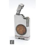 A large 1950s aluminium pocket lighter inset with Marie Theresa dollar dated 1780, height 8.5cm.