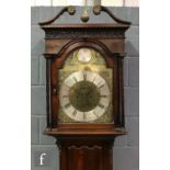 A George III mahogany longcase clock with an eight-day movement striking on a bell, the hood with