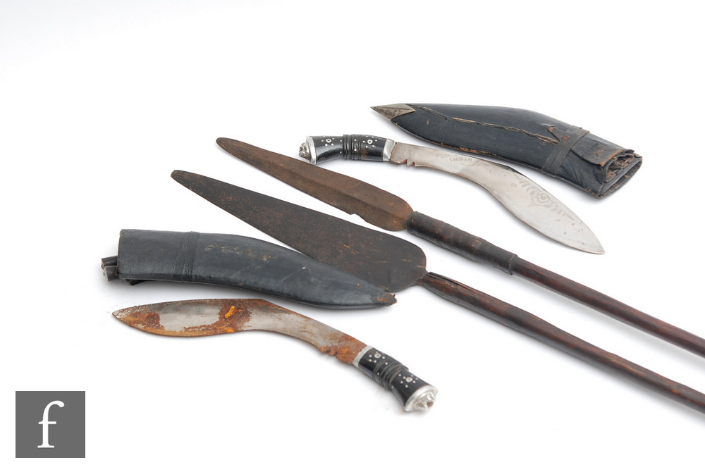 Two late 19th and early 20th century African wooden shafted throwing spears, one with detail to