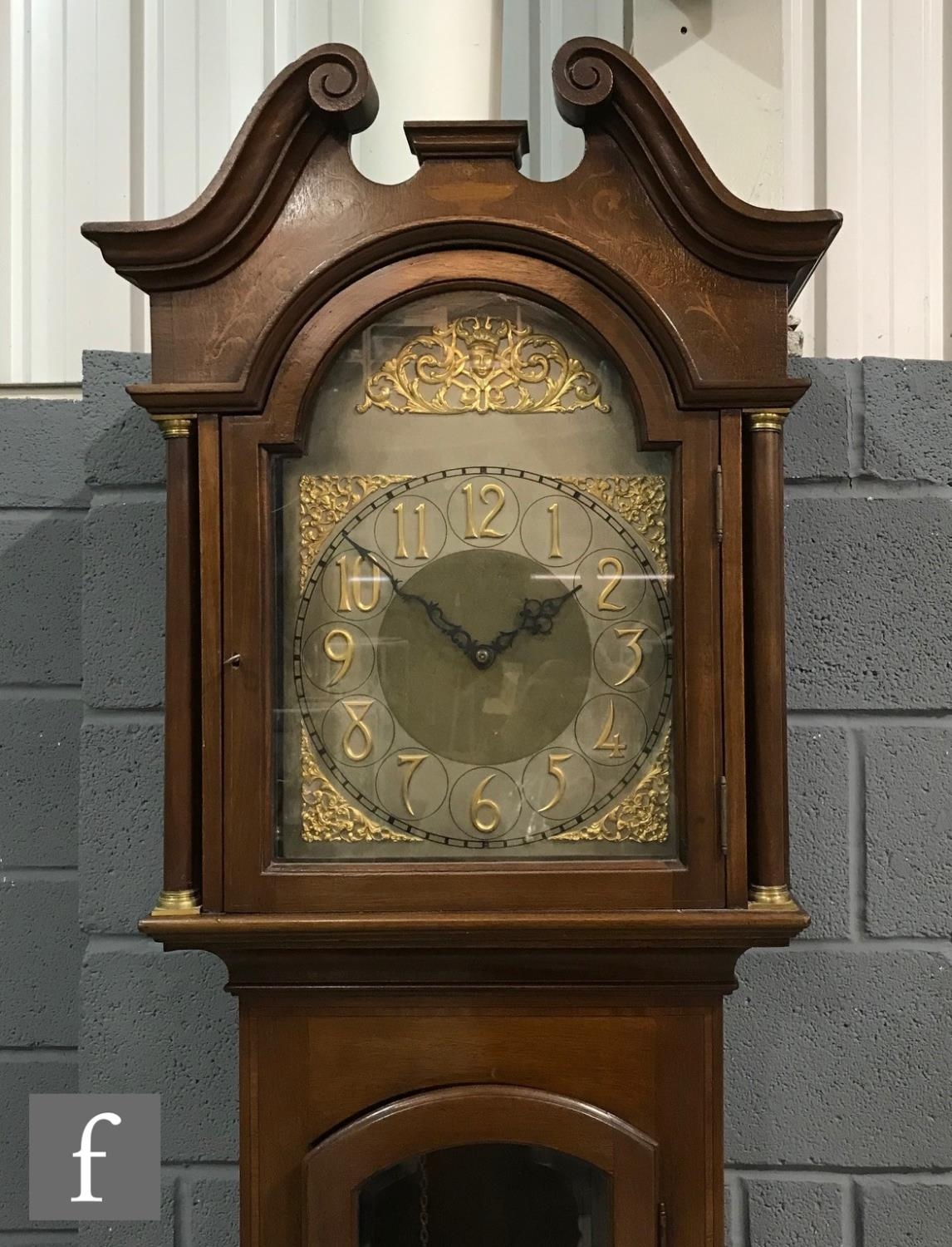 An Edwardian mahogany longcase clock, the Arabic arch dial with matted centre, spandrels and eight