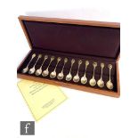 A cased set of twelve hallmarked silver tea spoons, The Royal Society for the Protection of Birds