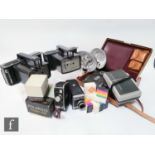 A collection of Polaroid and Shackman items to include three passport cameras, various Polaroid land