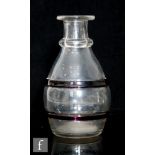 A late Georgian carafe circa 1800, of barrel form with single ringed neck and flat rim, decorated