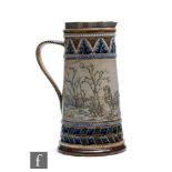 A late 19th Century Doulton Lambeth jug decorated by Hannah Barlow with an incised band showing