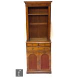 A Regency rosewood bookcase of narrow proportions, the upper section fitted with adjustable