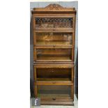 An early 20th Century Globe Wernicke oak five tier waterfall bookcase, the acanthus scroll