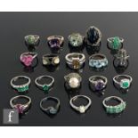 Nineteen assorted silver stone set dress rings to include marcasite, amethyst and emerald