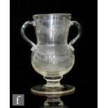 A late 18th to early 19th Century continental pedestal vase of spherical form with collar neck and