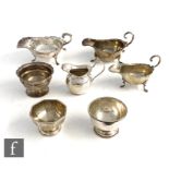 Seven items of hallmarked silver to include three sauce boats, three small pedestal sugar bowls