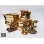 A contemporary graduated set of four Indian brass jardinières with gadroon decoration, together with