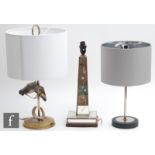 A collection of three various table lamps, to include an equestrian example, with twin light