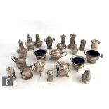 Twenty one assorted hallmarked silver condiments to include mustard and pepper pots, open salts etc,
