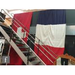 Two large woven flags, to include a French example, 360cm x 170cm, together with a Swiss flag, 360cm