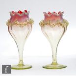 A pair of late 19th Century Sunrise opal posy vases of tulip form in a graduated cranberry to citron
