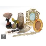 A collection of assorted items to include a brass photo frame with pierced decoration, marked H