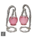 A pair of late 19th Century hanging posy vases, the footed posies in pink over opal with a clear