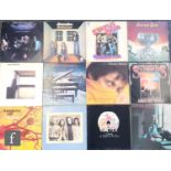 A collection of rock, pop and folk LPs, artists include Emerson, Lake and Palmer, Queen, The