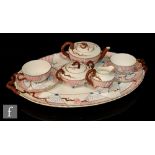 A late 19th Century Wedgwood Aesthetic cabaret tete-a-tete set comprising squat teapot, milk jug,