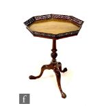 A late 19th or early 20th Century octagonal mahogany occasional or silver table with pierced gallery