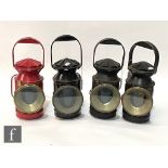 A SER black painted hand lamp and three BR (SR) hand lamps including a red painted example. (4)